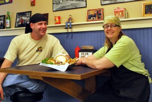 Rich & Kirsten Shellene pictured with a Coleslaw Burger and hand-cut fries