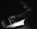 man injecting heroin