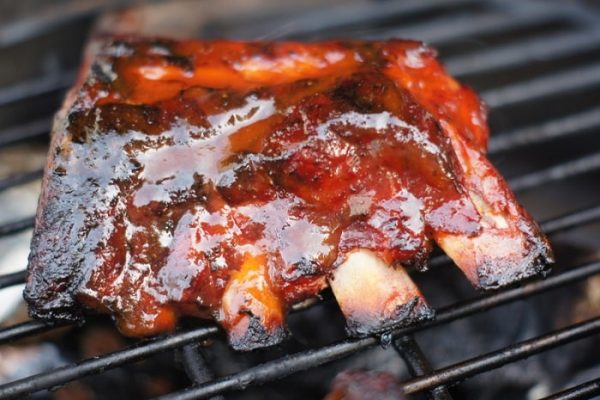 This recipe for barbecued baby back ribs will have all the folks gathered ‘round your grill eager to get the ribs onto their plates and into their bellies.