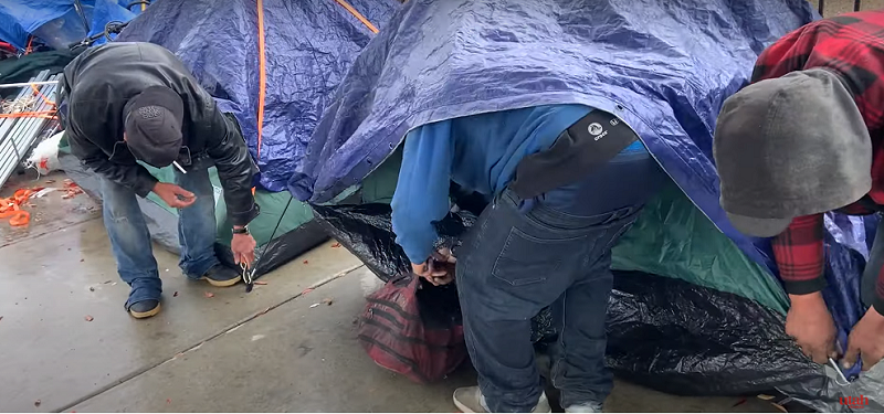 A group of unsheltered men in Salt Lake forced to move their camp in inclement weather.