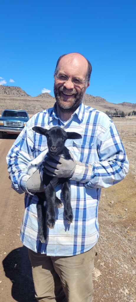 Ben Jackson and one of the Spring lambs. Utah Stories