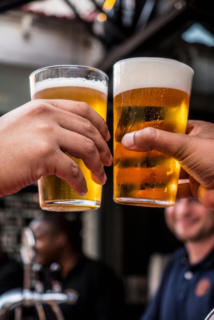 Cheers with beer. Photo by Tembela Bohle/Pexels.